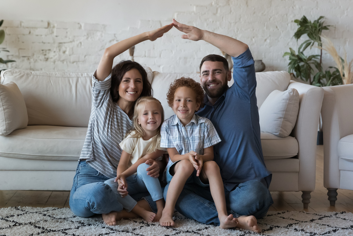 Happy well-being homeowners, first house buyers family portrait