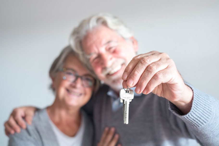 Couple of Seniors Holding a House Keys